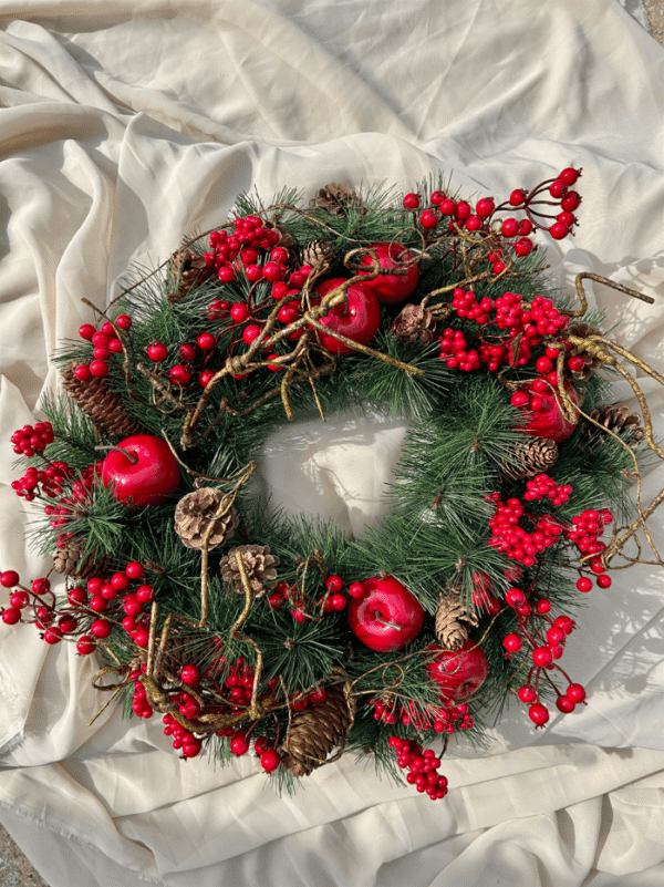 Artificial Wreath with red ornaments..