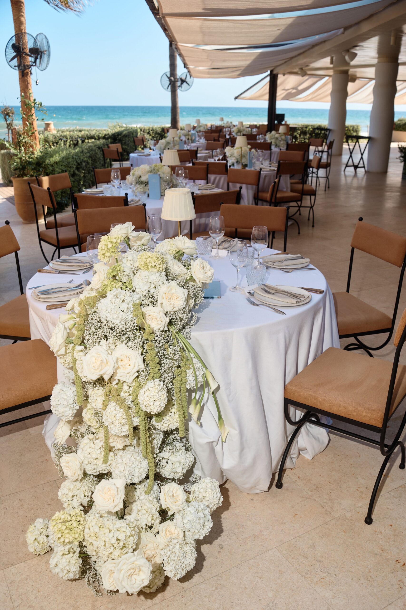 Cascading floral arrangement for a wedding by Lemonface Deco, Marbella